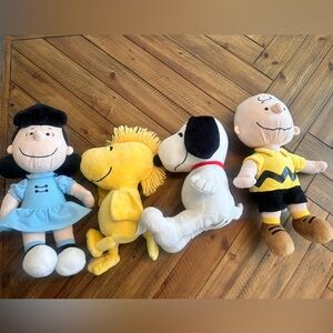 Like new- Peanuts plushies. Charlie Brown, Lucy, Snoopy & Woodstock.